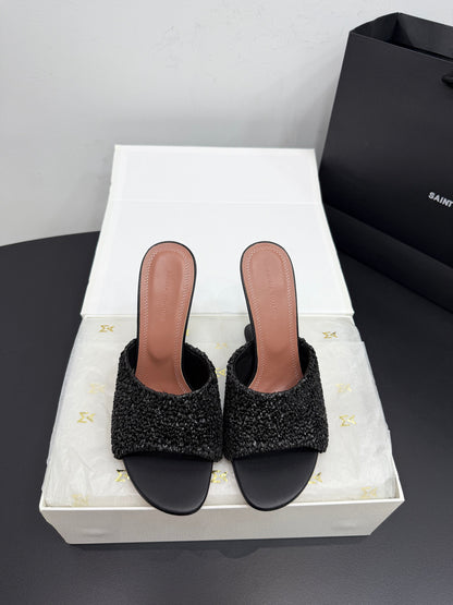 AMINA M HEELS