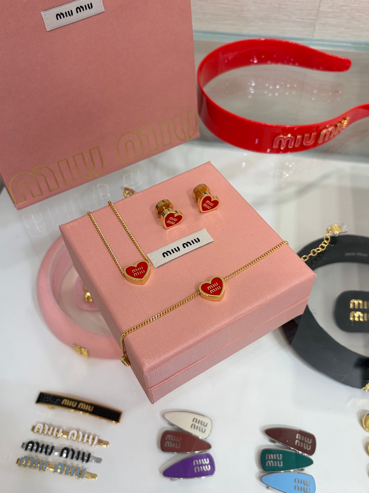 MIU M EARRINGS