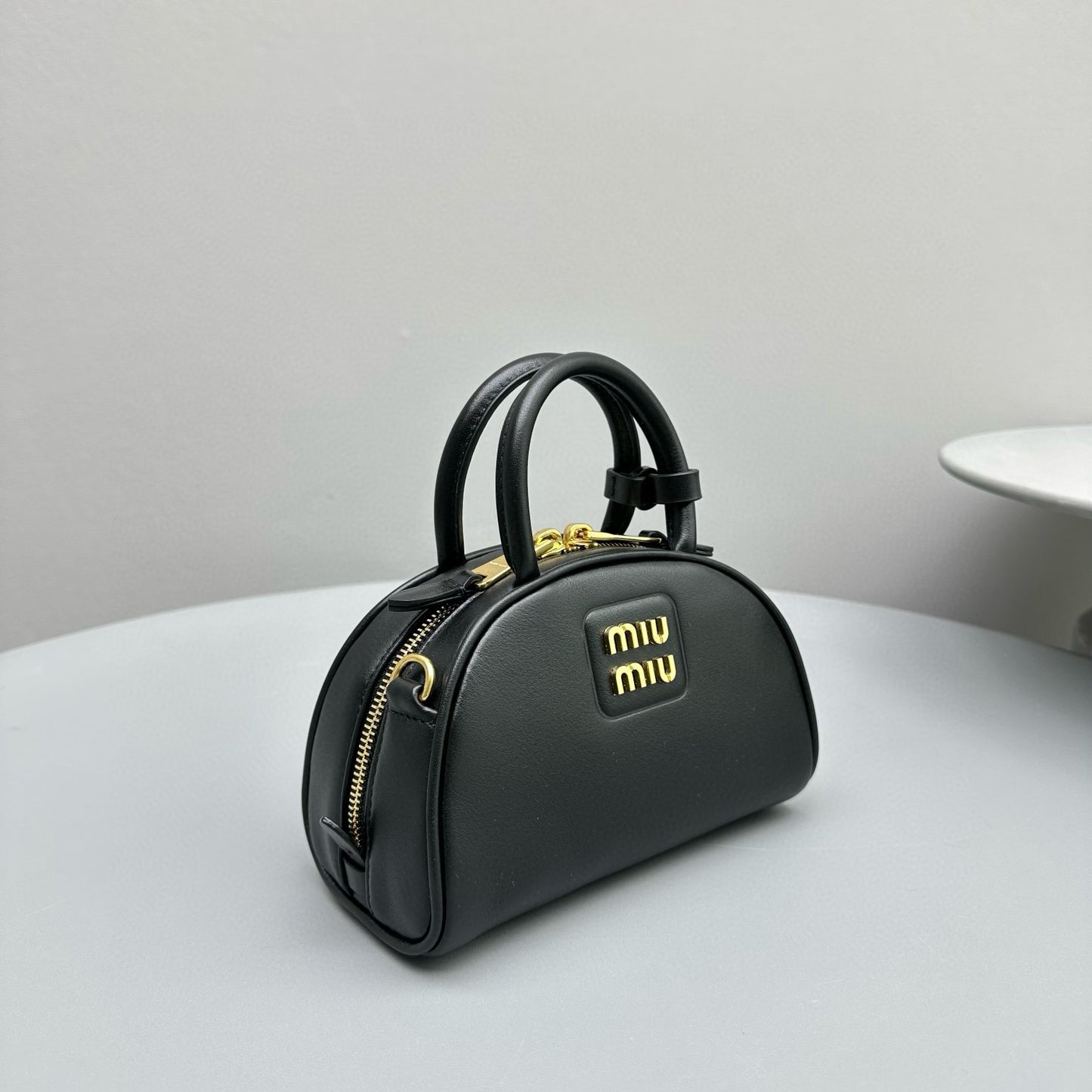 MIU M LEATHER TOP HANDLE BAG