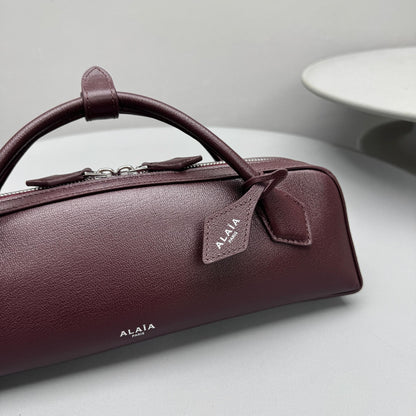 ALAIA LE TECKEL CLUTCH