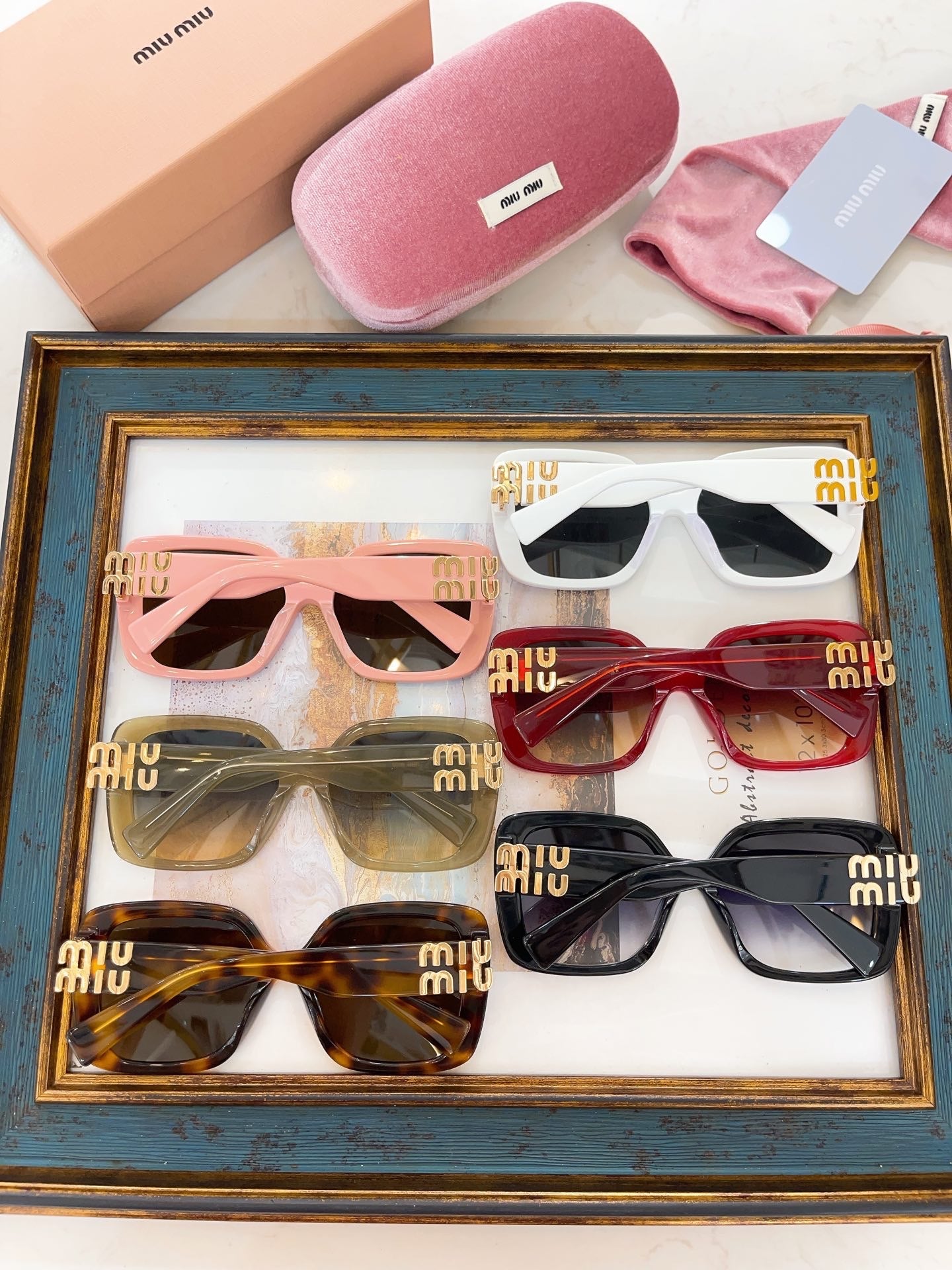 MIU M SUNGLASSES