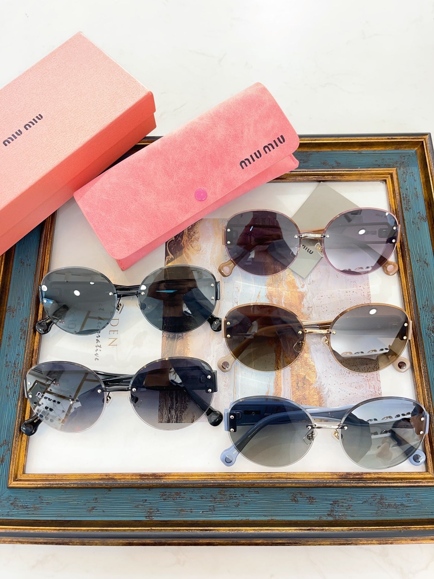 MIU M SUNGLASSES