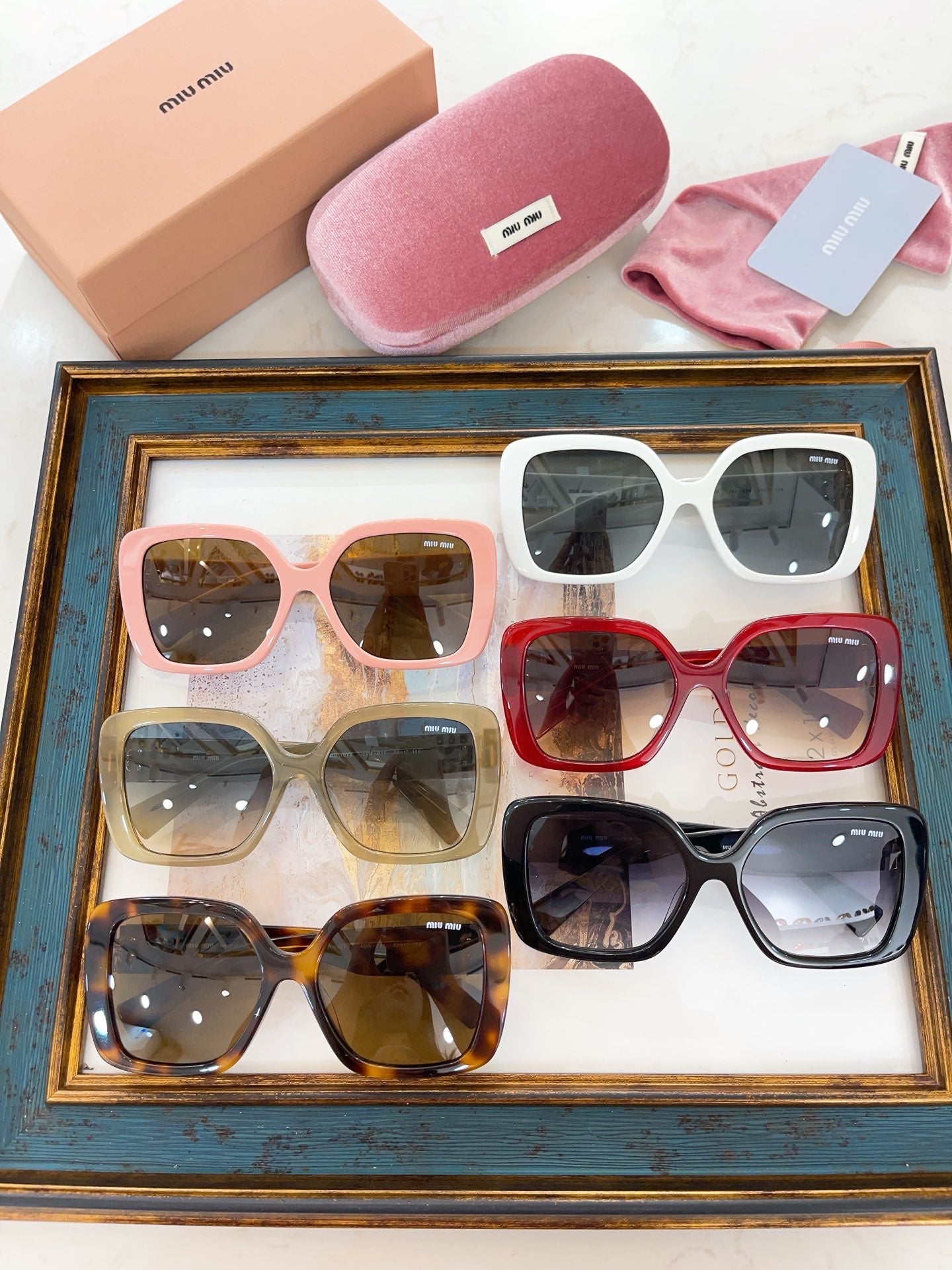 MIU M SUNGLASSES