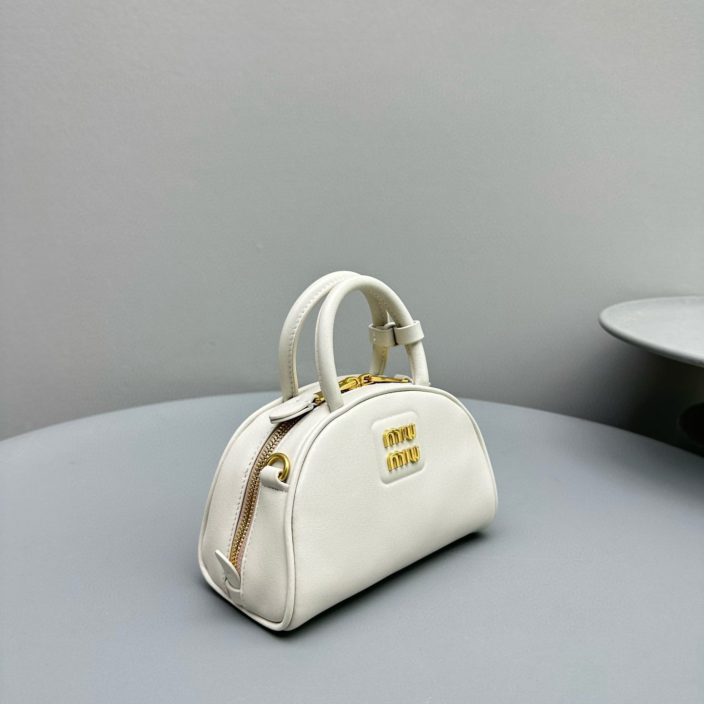 MIU M LEATHER TOP HANDLE BAG