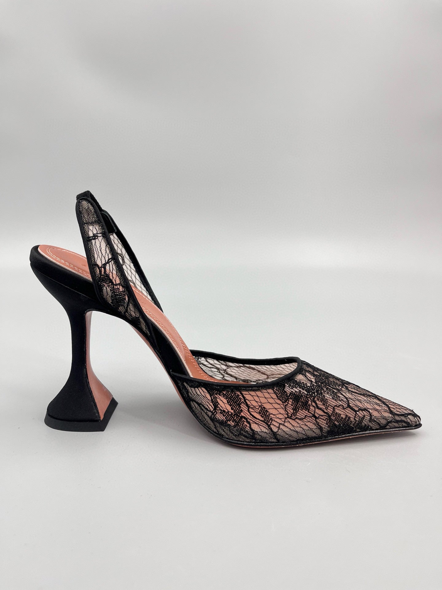 AMINA M HEELS