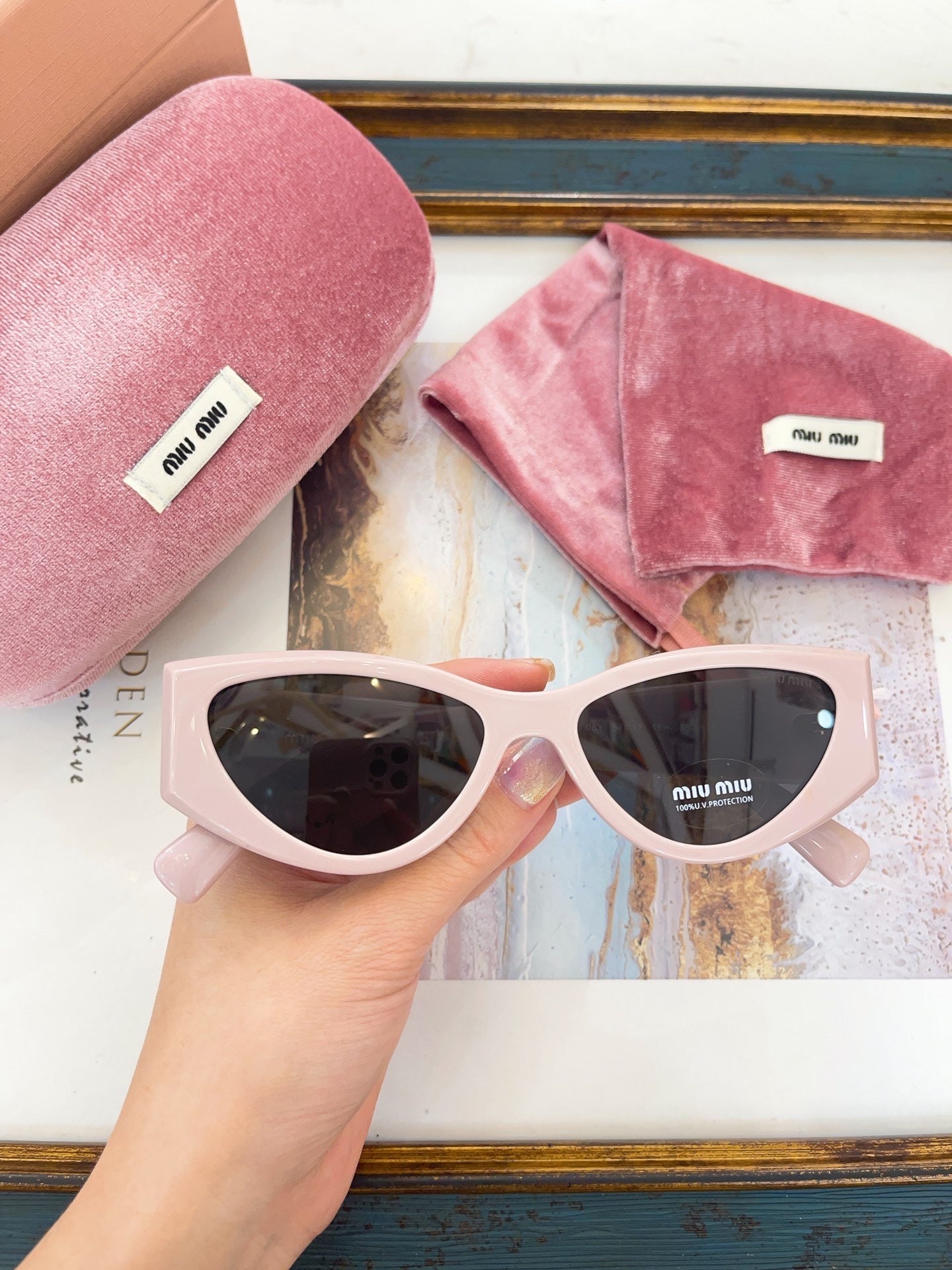 MIU M SUNGLASSES