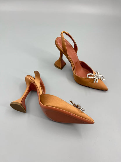 AMINA M HEELS