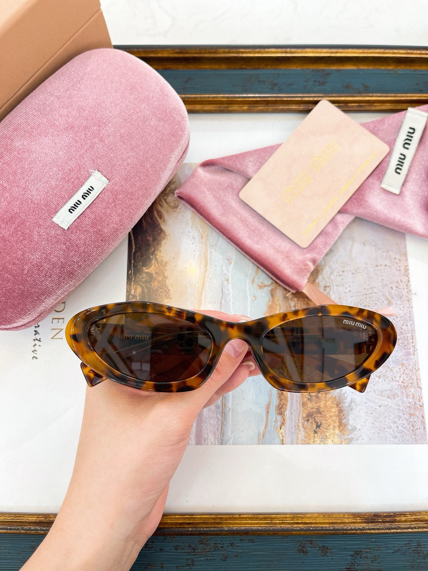 MIU M SUNGLASSES