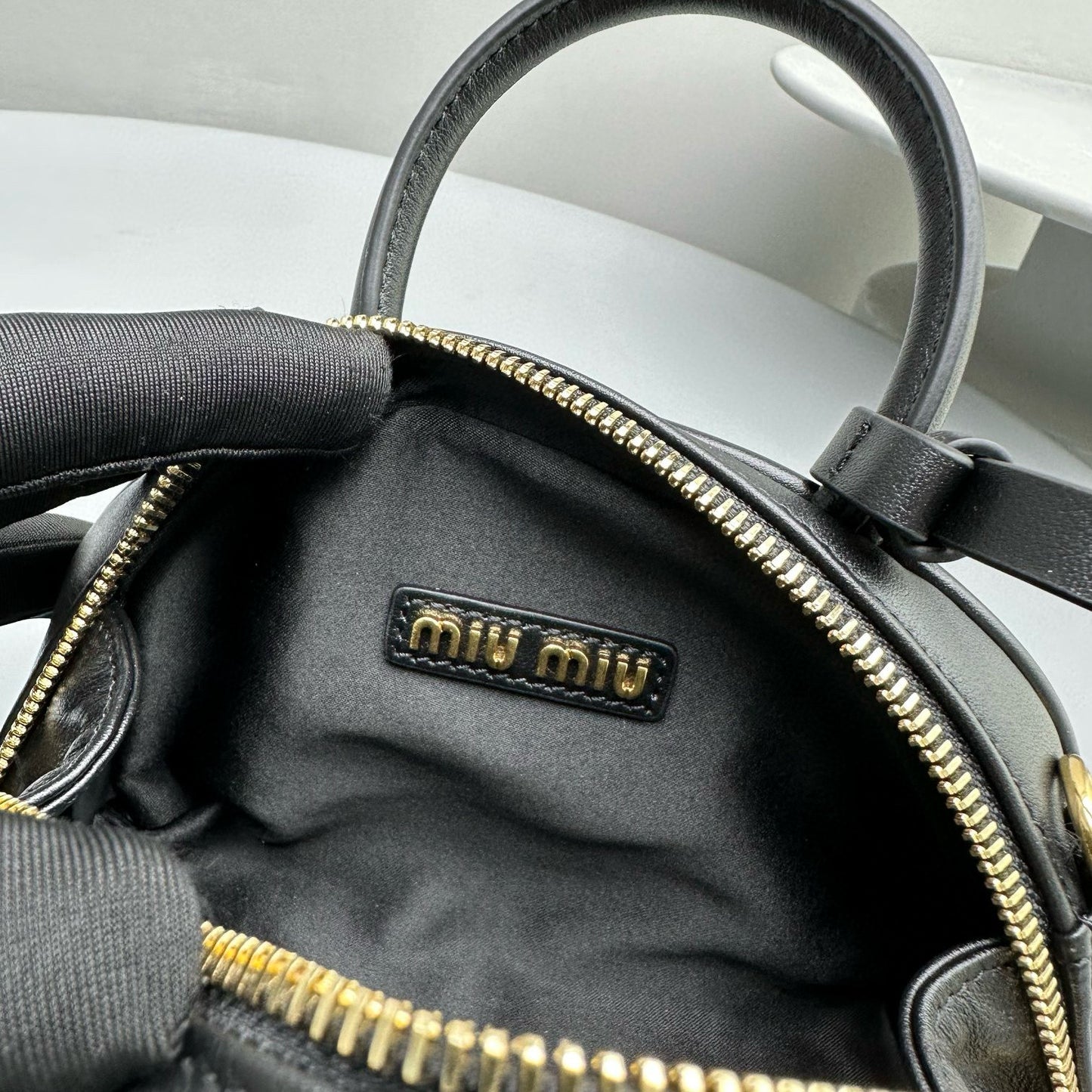 MIU M LEATHER TOP HANDLE BAG