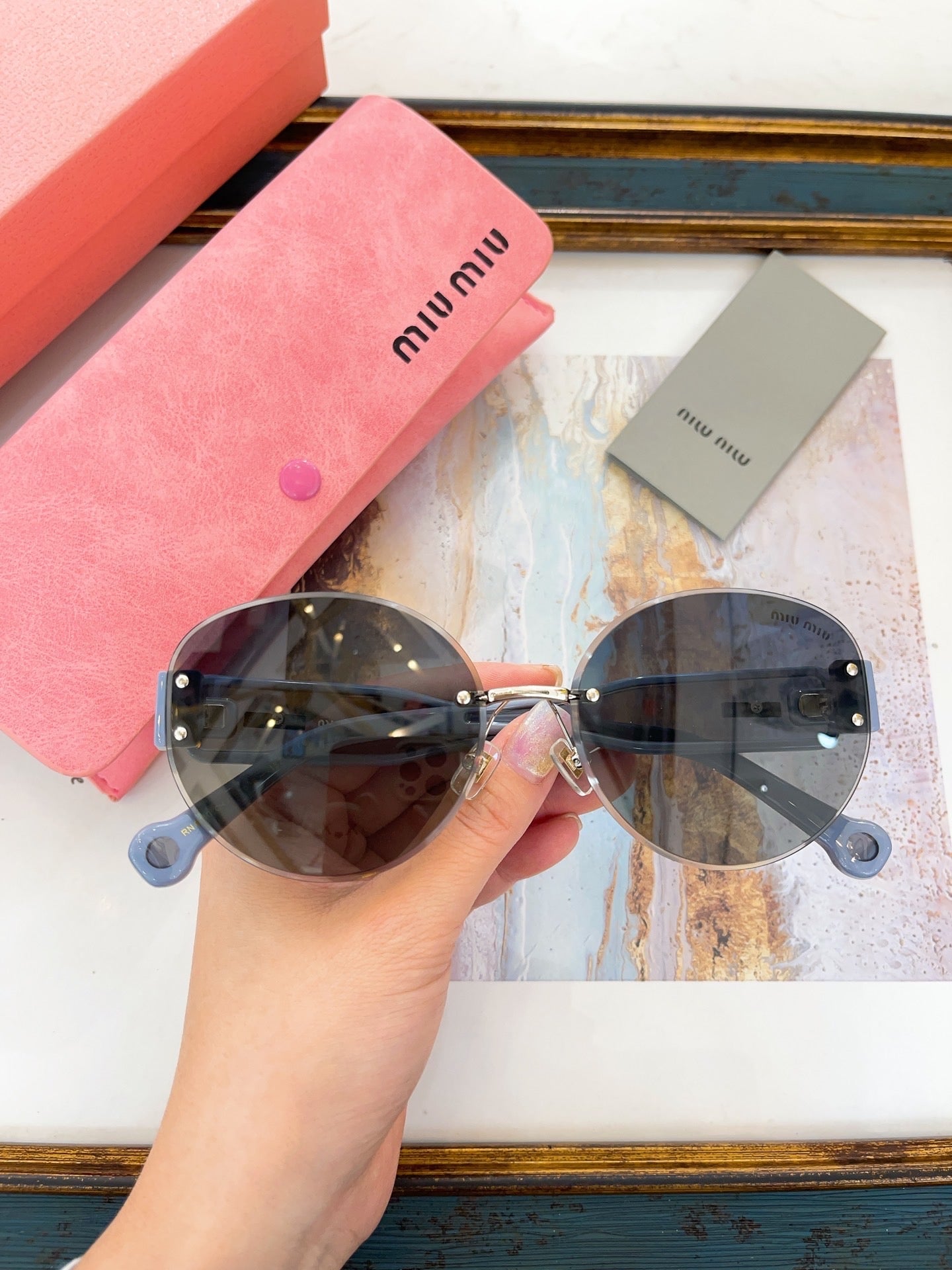 MIU M SUNGLASSES