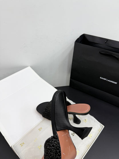 AMINA M HEELS