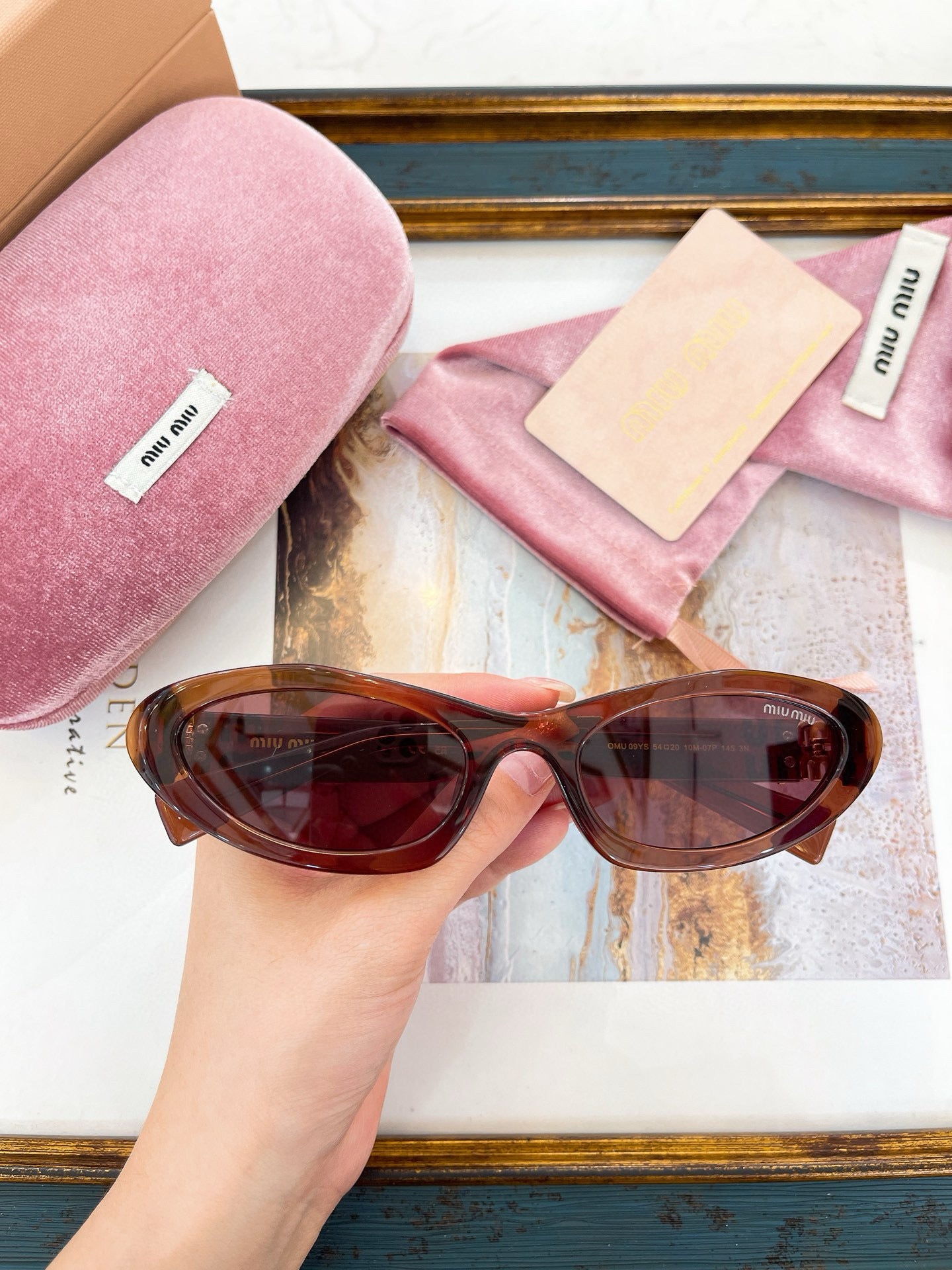 MIU M SUNGLASSES