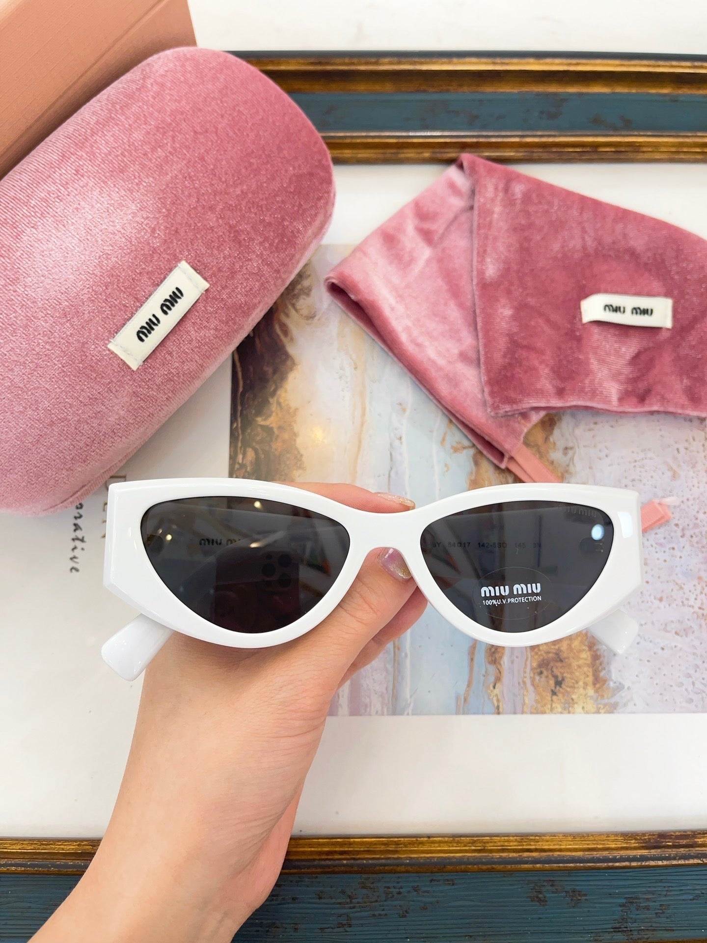 MIU M SUNGLASSES