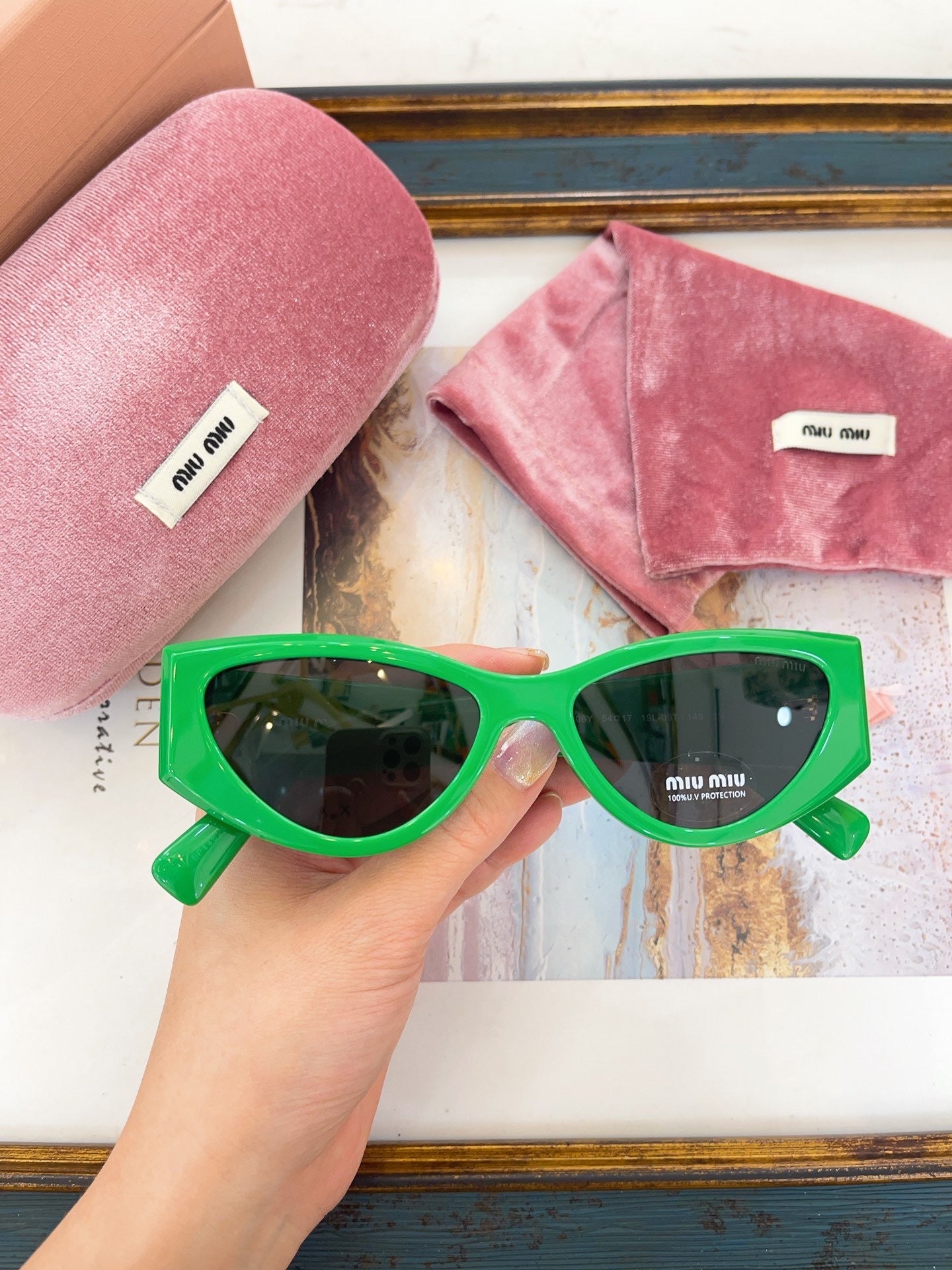 MIU M SUNGLASSES