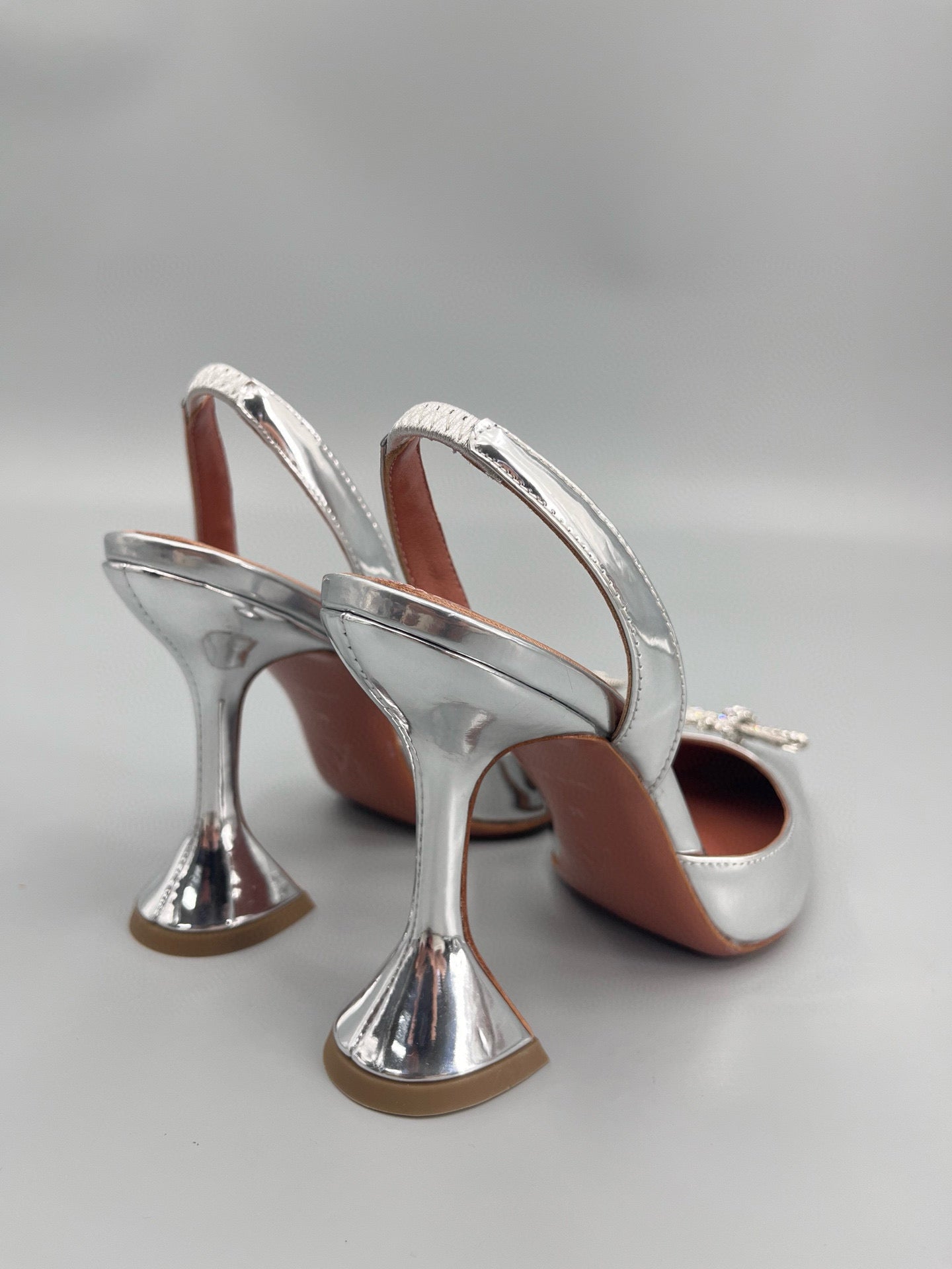 AMINA M HEELS