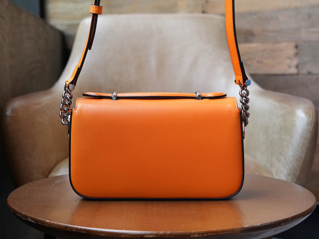 Petite GG mini shoulder bag in orange leather